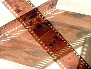 Photo negatives, resulting from the reduction of silver ions into metallic silver