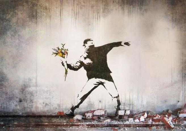 Soldier throwing flowers banksy