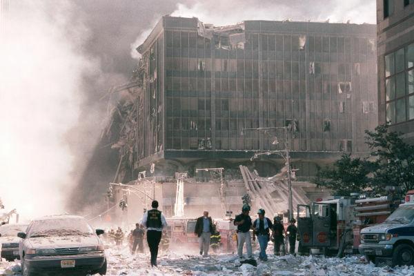 Debris from the September 11 attacks and people walking in the street.