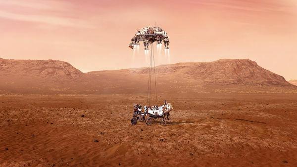 Rover Perseverance és ereszkedési modul, amely érinti a Mars talaját. [3]