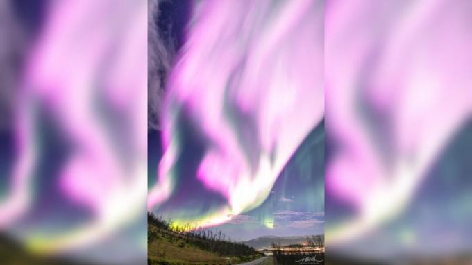 Roze aurora borealis, dat als zeldzaam wordt beschouwd, wordt gezien in de lucht van Noorwegen