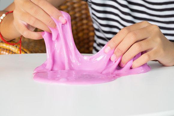 How to make slime? - Child playing with pink slime 