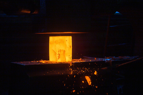  Metal block undergoing a steelmaking process.