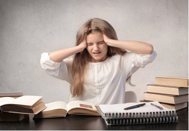 Child with headache when doing homework due to difficulty in seeing